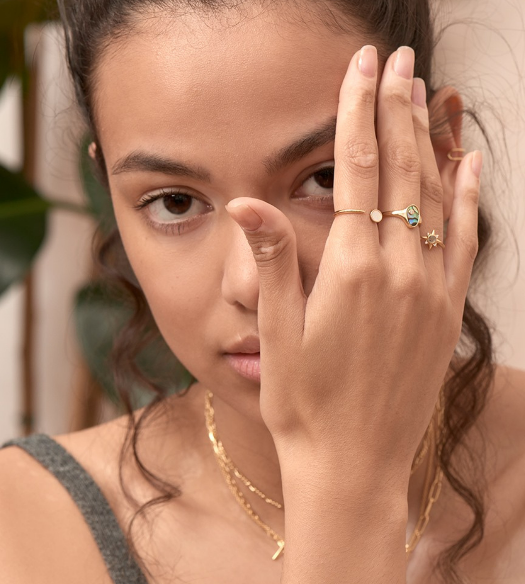 Model wearing stacked rings by Ania Haie