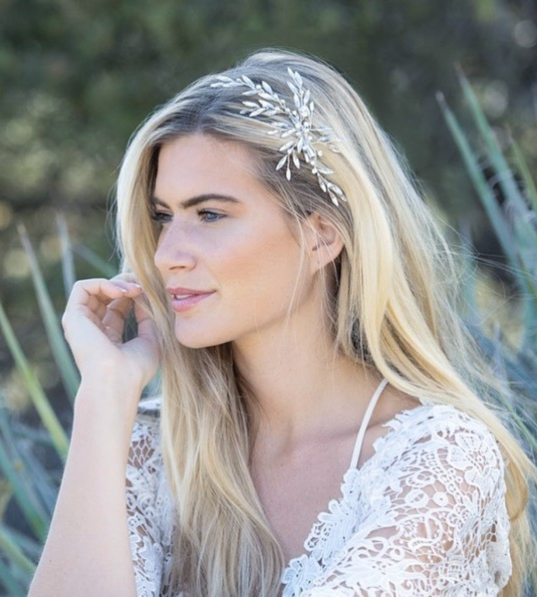 Woman wearing wedding hair piece by Ivory and co