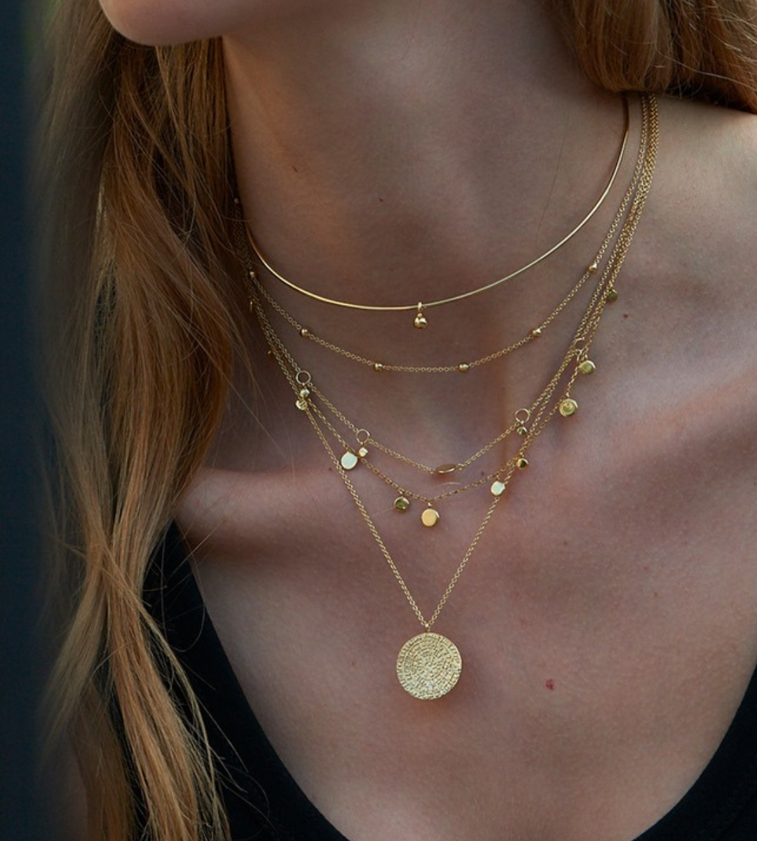 woman wearing necklaces by ania haie