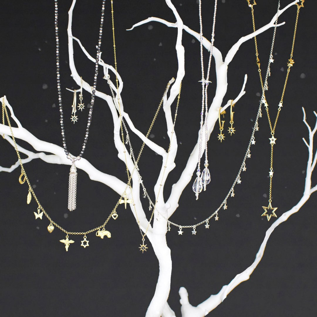 Annie Haak jewellery displayed on a branch