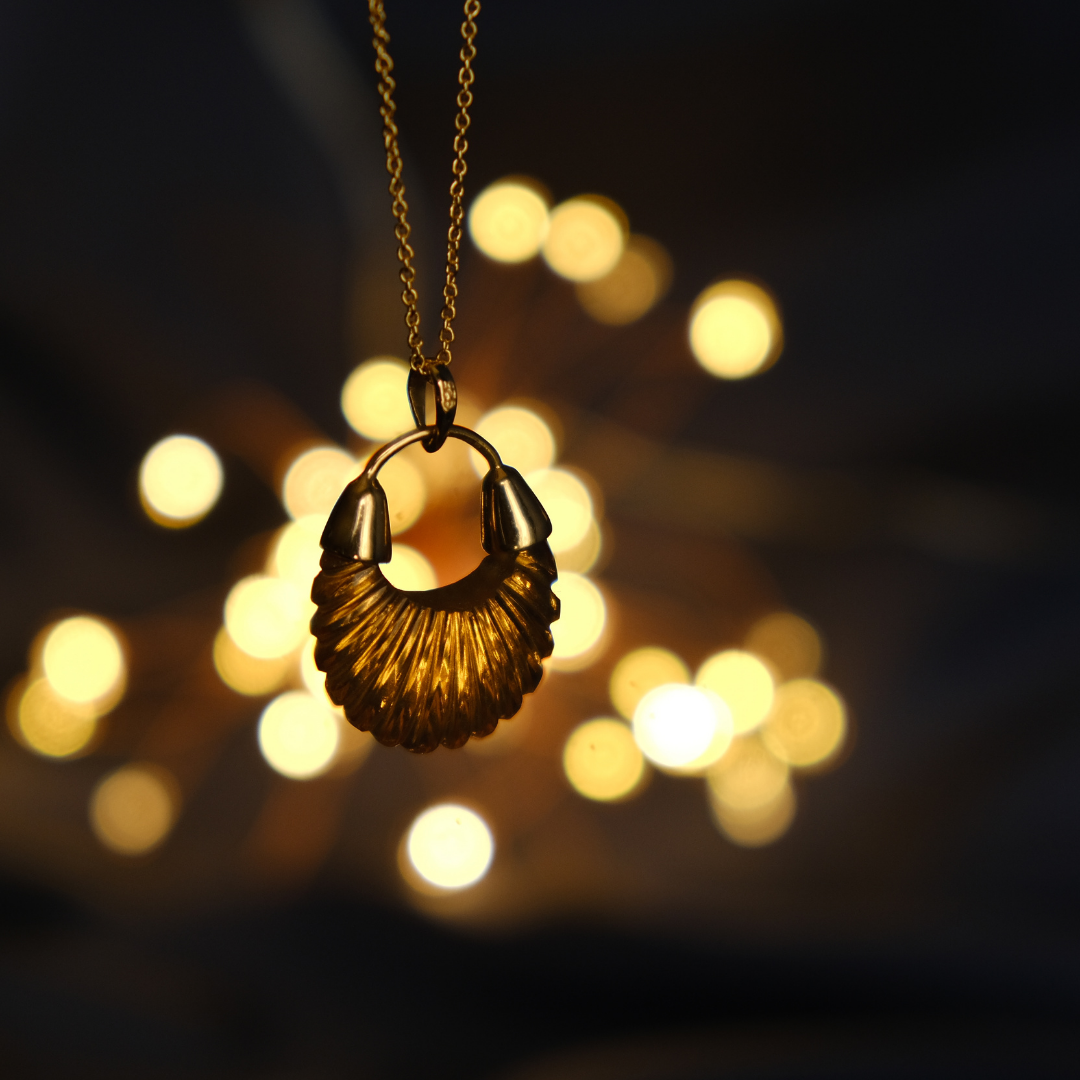 Photograph of shyla ettiene necklace in front of some lights
