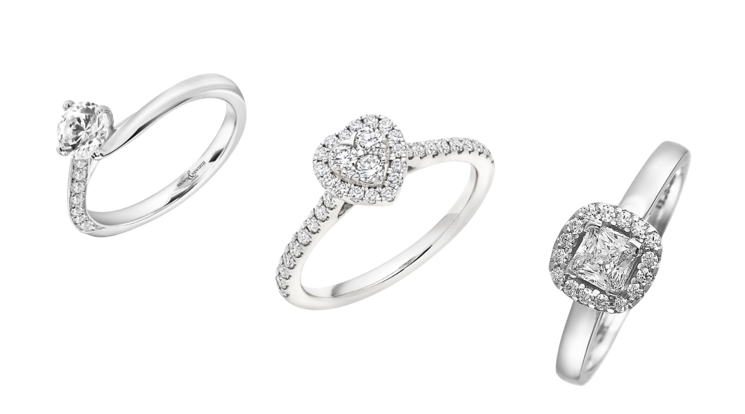 Photograph of three different engagement ring styles in white gold and diamonds. One has a heart shaped stone, one has a square cut diamond and the other is a more modern style with a single diamond and a twisted diamond studded band