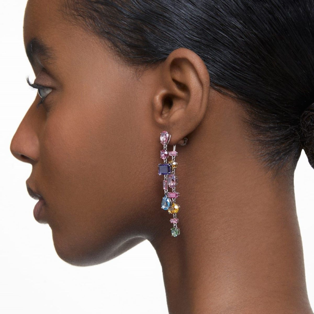 Woman wearing Swarovski gema earrings
