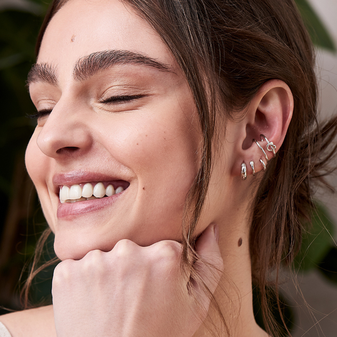 woman wearing earrings by ania haie