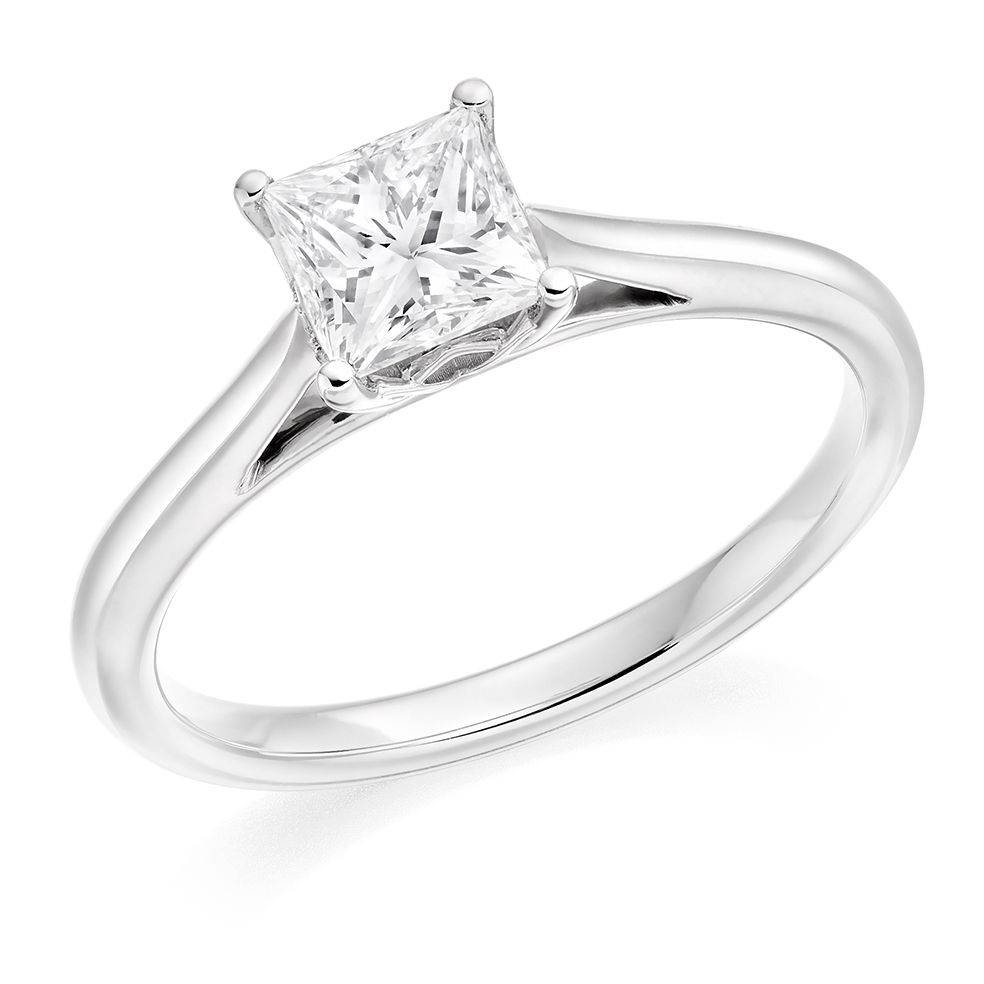 Berry's 18ct White Gold Princess Cut Diamond Rub Over Set Solitaire Ring  With Round Brilliant Cut Channel Set Diamond Shoulders